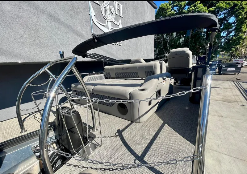 Slide: The Image of 2025 Barletta Lusso 23UC pontoon boat with luxurious seating and sleek design. - 15