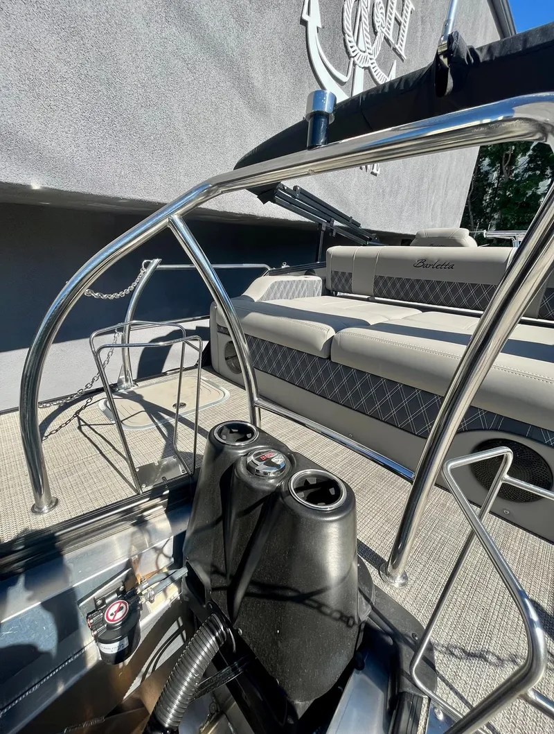 Slide: The Image of 2025 Barletta Lusso 23UC pontoon boat interior with luxurious seating and sleek design. - 16