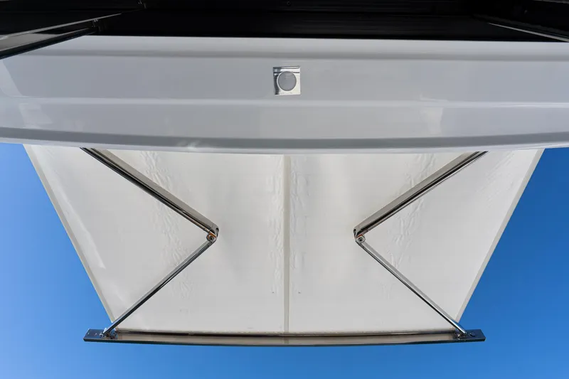 Slide: The Image of 2023 Cruisers Yachts 42 Cantius retractable sunshade against blue sky. - 10