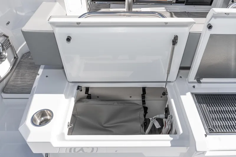 Slide: The Image of Open storage compartment on the 2023 Cruisers Yachts 42 Cantius. - 12
