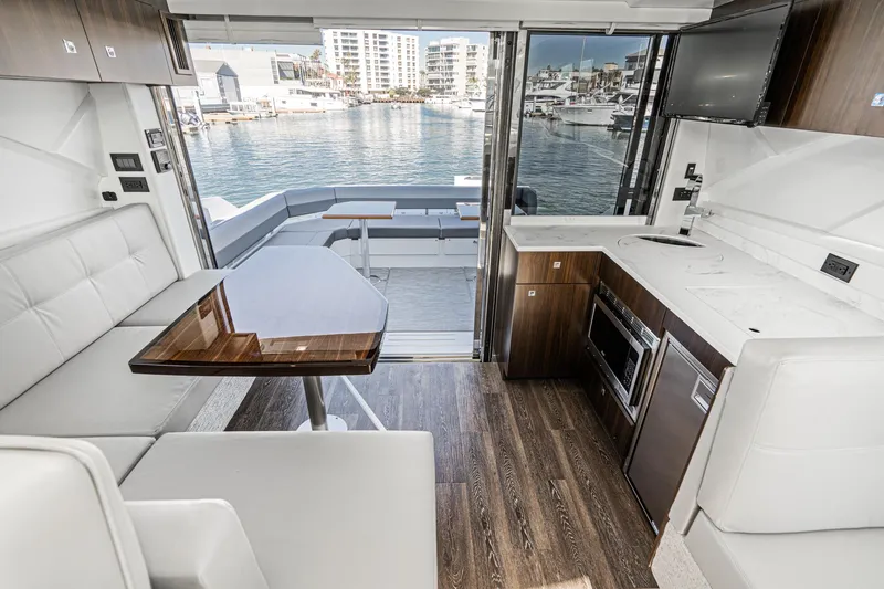 Slide: The Image of Luxurious interior of 2023 Cruisers Yachts 42 Cantius with waterfront view. - 20