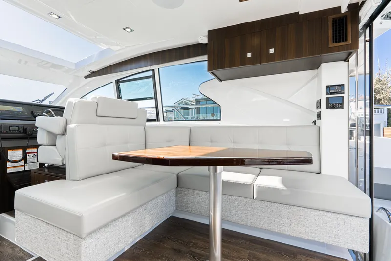 Slide: The Image of Luxurious interior of 2023 Cruisers Yachts 42 Cantius with modern seating and dining area. - 22