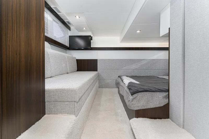 Slide: The Image of 2023 Cruisers Yachts 42 Cantius interior cabin with modern seating and bed. - 39