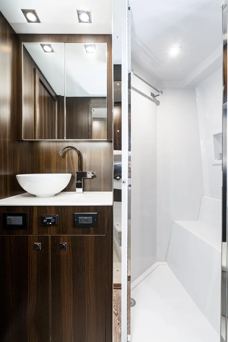 Slide: The Image of Modern bathroom in 2023 Cruisers Yachts 42 Cantius with sleek wood cabinetry. - 43