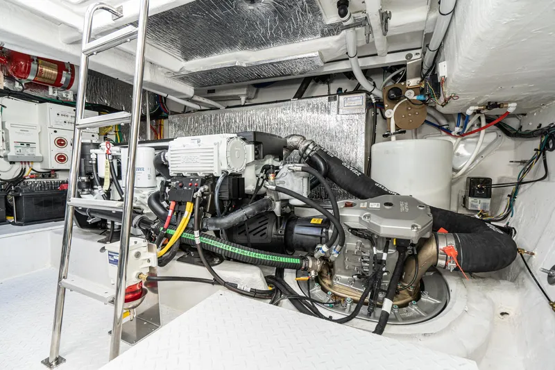 Slide: The Image of Engine room of 2023 Cruisers Yachts 42 Cantius with modern equipment and wiring. - 46