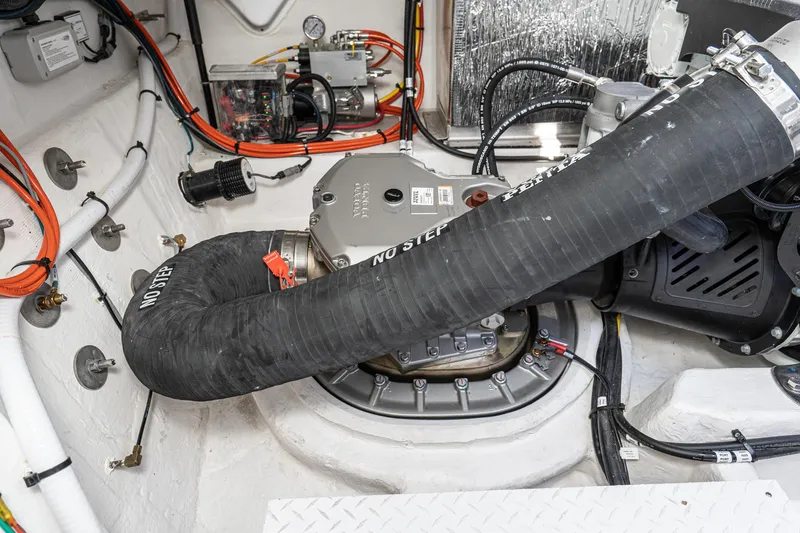 Slide: The Image of Engine compartment of 2023 Cruisers Yachts 42 Cantius with visible wiring and components. - 47