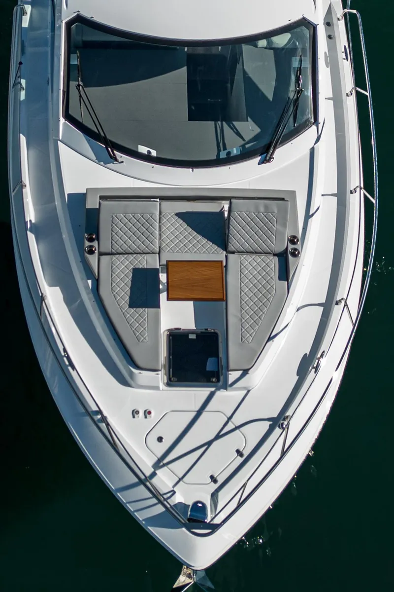 Slide: The Image of 2023 Cruisers Yachts 42 Cantius luxury boat deck with sun loungers and table. - 5