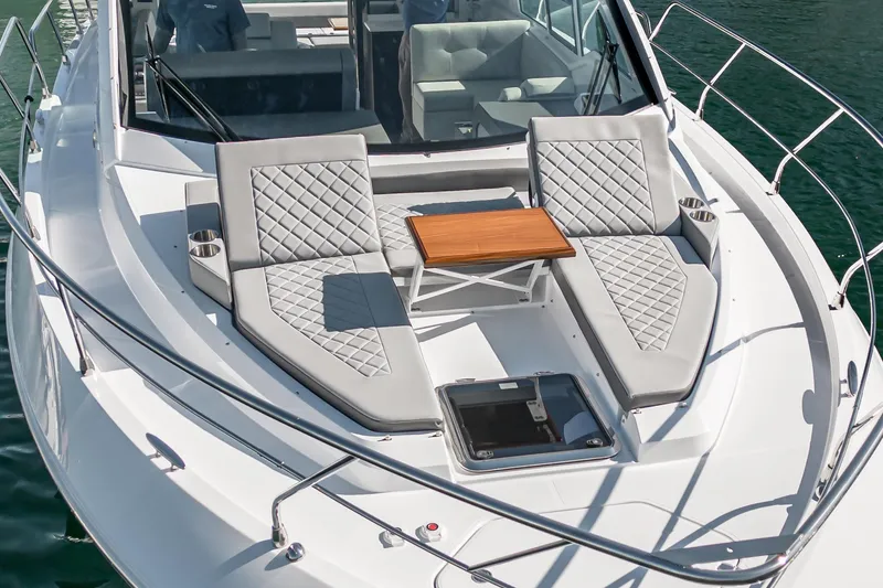 Slide: The Image of 2023 Cruisers Yachts 42 Cantius with luxurious sun loungers and table on the deck. - 6