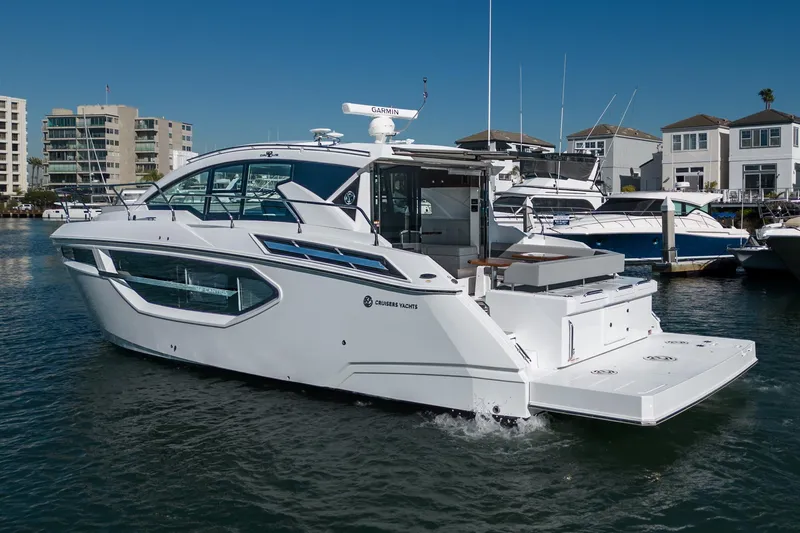 Slide: The Image of 2023 Cruisers Yachts 42 Cantius luxury motor yacht docked in marina. - 7