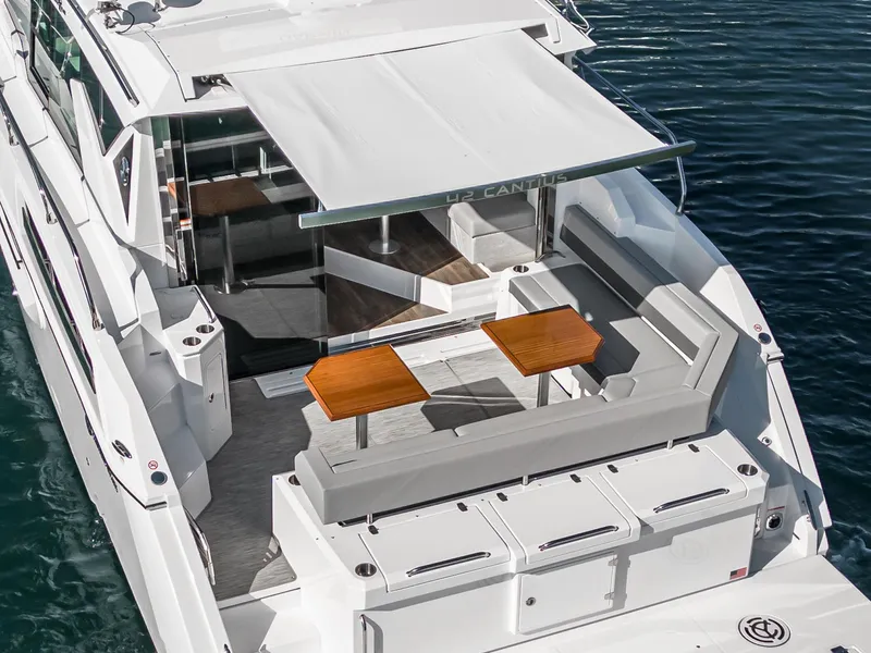 Slide: The Image of 2023 Cruisers Yachts 42 Cantius luxury boat with spacious outdoor seating area. - 9