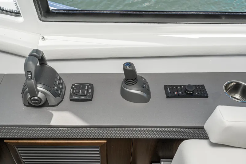Slide: The Image of 2023 Cruisers Yachts 42 Cantius helm controls and joystick. - 33