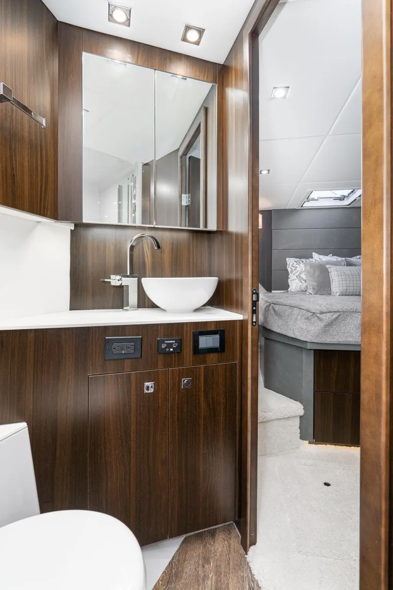 Slide: The Image of 2023 Cruisers Yachts 42 Cantius bathroom with modern fixtures and bedroom view. - 37