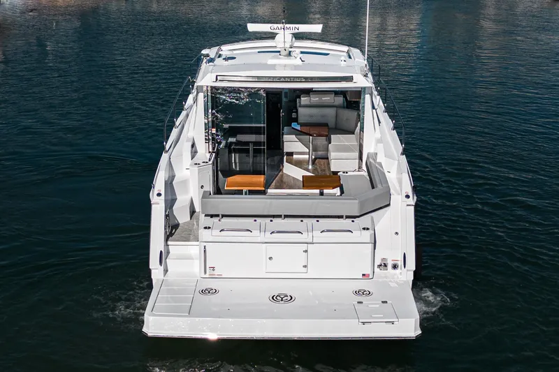 Slide: The Image of 2023 Cruisers Yachts 42 Cantius luxury motor yacht on water, rear view. - 8
