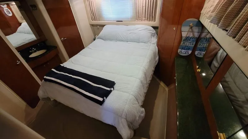 Slide: The Image of Interior cabin of a 2003 Sea Ray 390 Motor Yacht with TV and wooden cabinetry. - 18