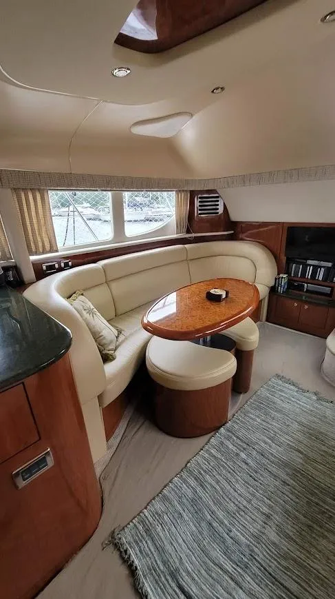 Slide: The Image of Luxurious bedroom in 2003 Sea Ray 390 Motor Yacht with cozy bed and elegant decor. - 20