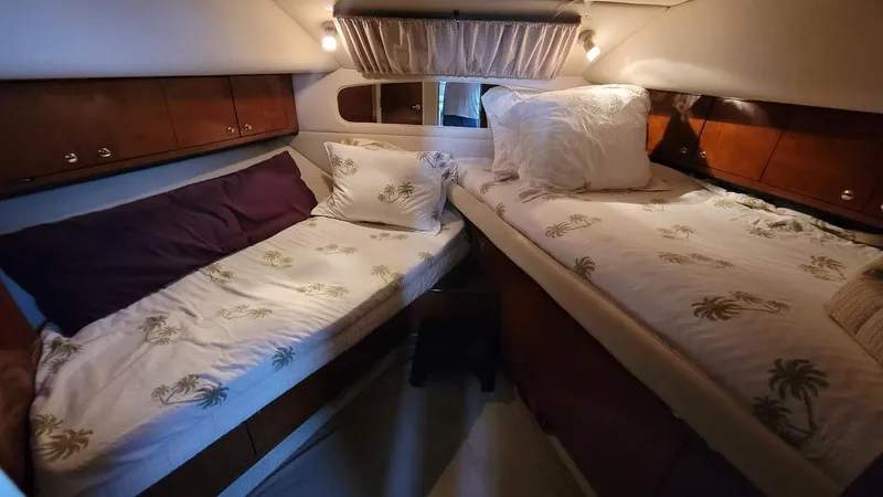 Slide: The Image of Luxurious interior of a 2003 Sea Ray 390 Motor Yacht with leather seating and wooden accents. - 22