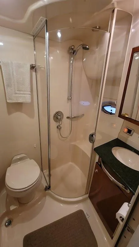 Slide: The Image of 2003 Sea Ray 390 Motor Yacht bathroom with shower, sink, and toilet. - 24