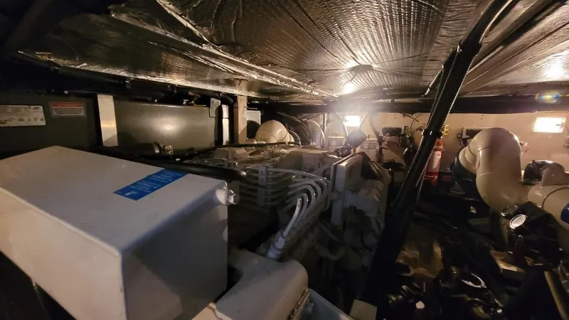 Slide: The Image of Engine room of a 2003 Sea Ray 390 Motor Yacht with visible machinery. - 31