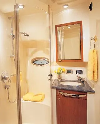 Slide: The Image of Engine room of a 2003 Sea Ray 390 Motor Yacht with visible machinery and fire extinguisher. - 35