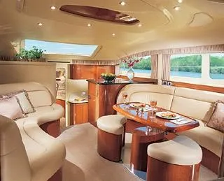 Slide: The Image of 2003 Sea Ray 390 Motor Yacht kitchen with wooden cabinets and black refrigerator. - 41