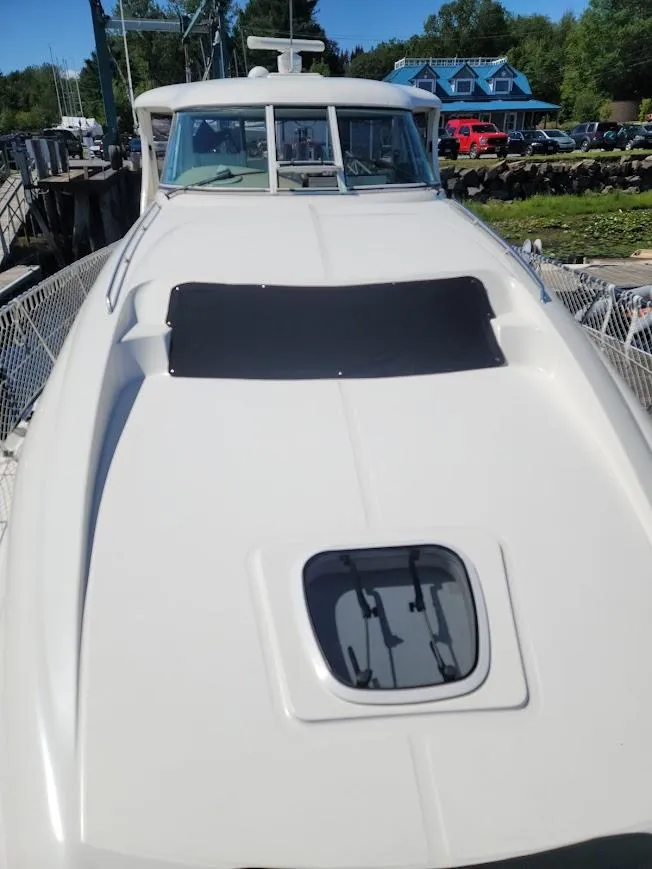 Slide: The Image of 2003 Sea Ray 390 Motor Yacht docked, front deck view. - 6