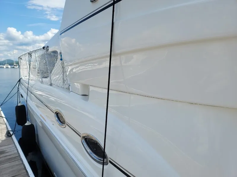 Slide: The Image of 2003 Sea Ray 390 Motor Yacht docked, side view. - 7