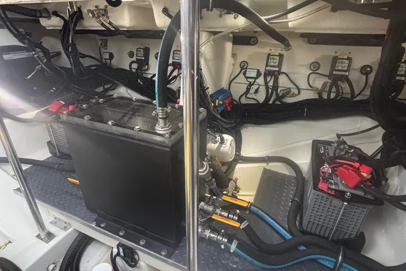 Slide: The Image of Engine compartment of 2022 Formula 380 Super Sport Crossover OB with wiring and components. - 104