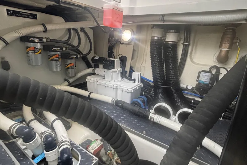 Slide: The Image of Engine room of 2022 Formula 380 Super Sport Crossover OB with Mercury filters and hoses. - 108