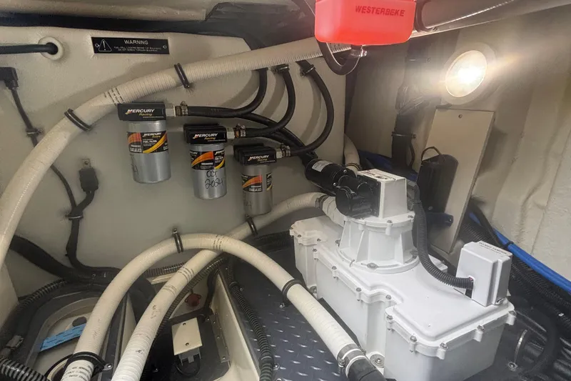 Slide: The Image of Engine compartment of 2022 Formula 380 Super Sport Crossover OB with Mercury filters and wiring. - 109