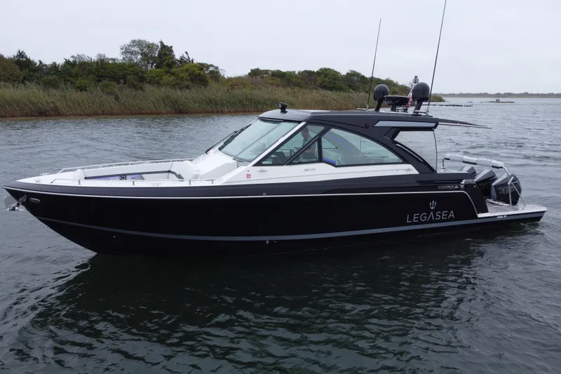 Slide: The Image of 2022 Formula 380 Super Sport Crossover OB boat on water, side view. - 21