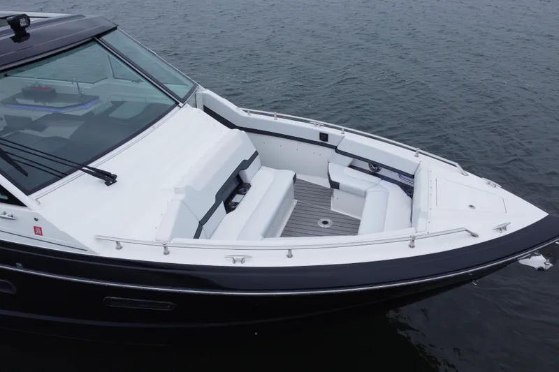 Slide: The Image of 2022 Formula 380 Super Sport Crossover OB boat on water, featuring sleek design and spacious seating. - 22