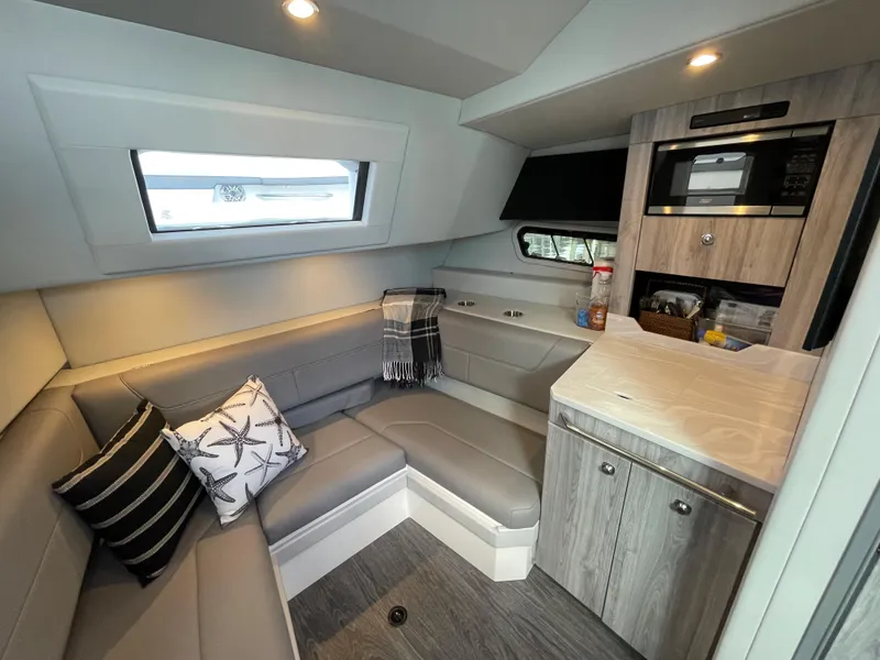 Slide: The Image of Interior of 2022 Formula 380 Super Sport Crossover OB with modern seating and kitchenette. - 38