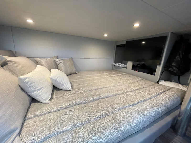Slide: The Image of Cozy cabin interior of 2022 Formula 380 Super Sport Crossover OB with bed and TV. - 42