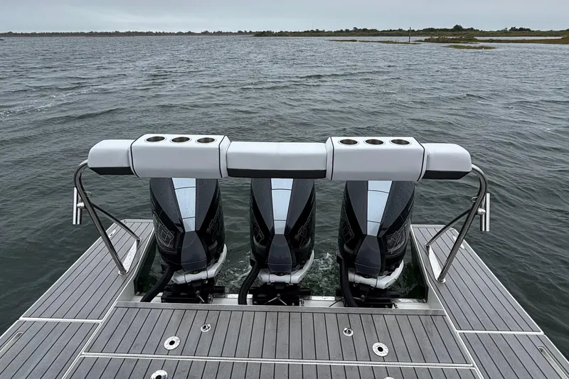 Slide: The Image of 2022 Formula 380 Super Sport Crossover OB with triple outboard engines on water. - 44