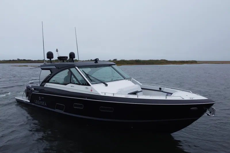 Slide: The Image of 2022 Formula 380 Super Sport Crossover OB boat on calm water. - 5