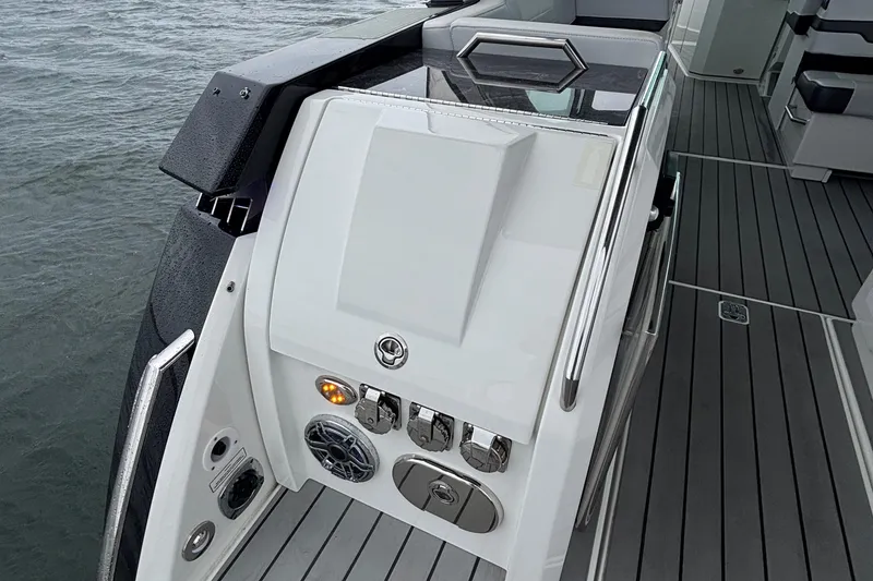 Slide: The Image of 2022 Formula 380 Super Sport Crossover OB boat deck with sleek design and controls. - 52