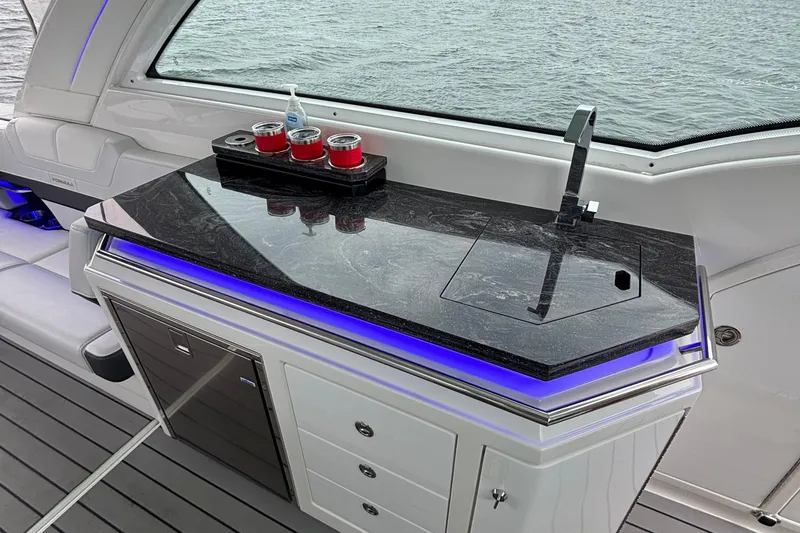 Slide: The Image of Luxurious 2022 Formula 380 Super Sport Crossover OB boat interior with sleek countertop and modern amenities. - 58