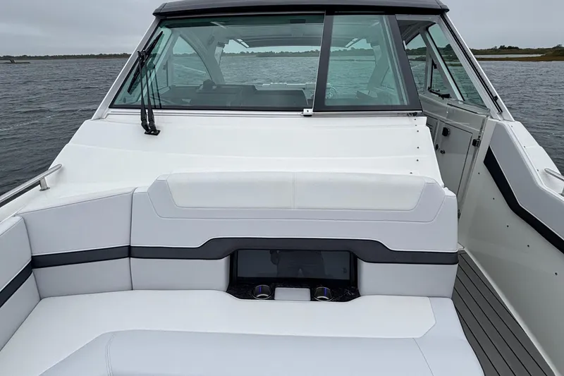 Slide: The Image of 2022 Formula 380 Super Sport Crossover OB boat interior with sleek seating and modern design. - 65
