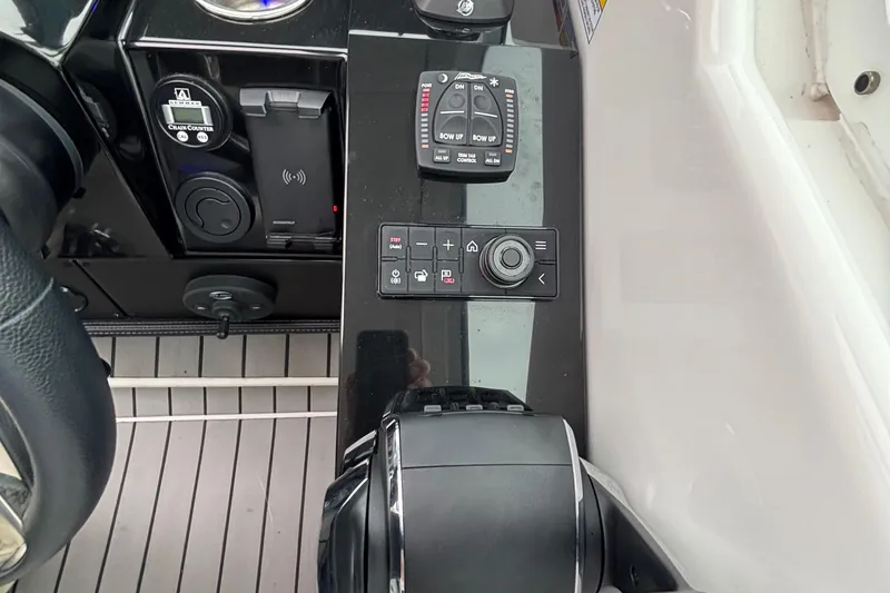 Slide: The Image of 2022 Formula 380 Super Sport Crossover OB helm controls with modern navigation features. - 77