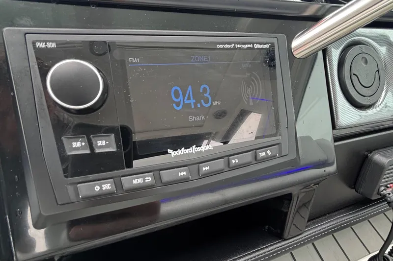 Slide: The Image of 2022 Formula 380 Super Sport Crossover OB stereo system displaying 94.3 FM radio station. - 99