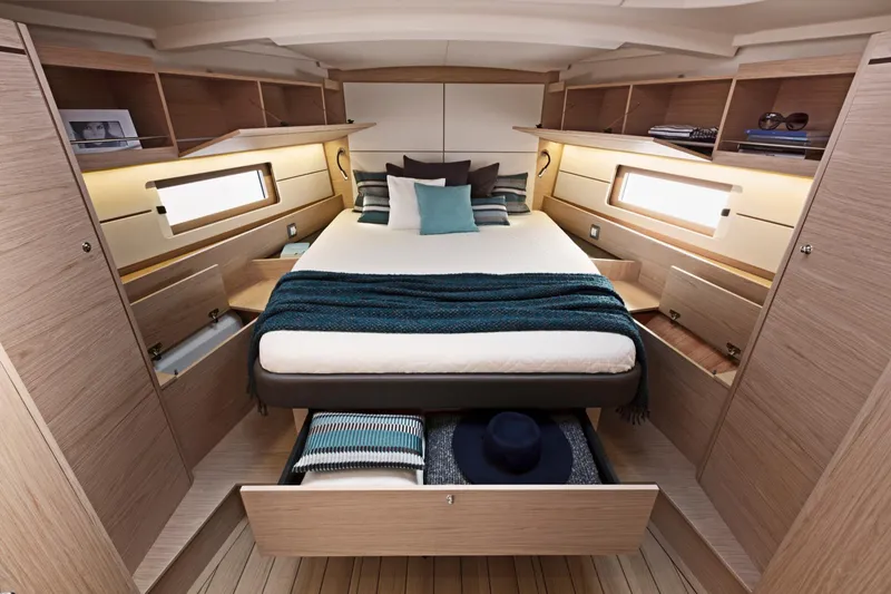 Slide: The Image of Luxurious bedroom in 2024 Beneteau Oceanis 46.1 yacht with modern design and ample storage. - 23