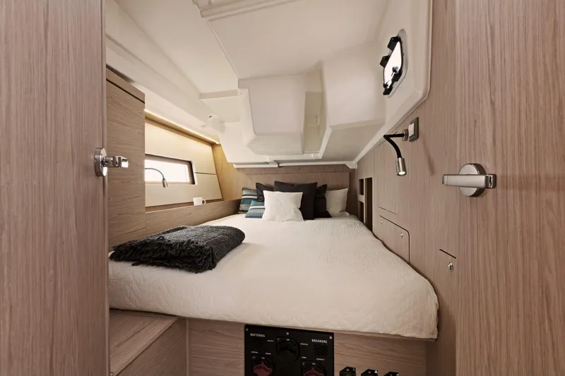 Slide: The Image of Beneteau Oceanis 46.1 2024 cabin interior with cozy bed and modern design. - 24