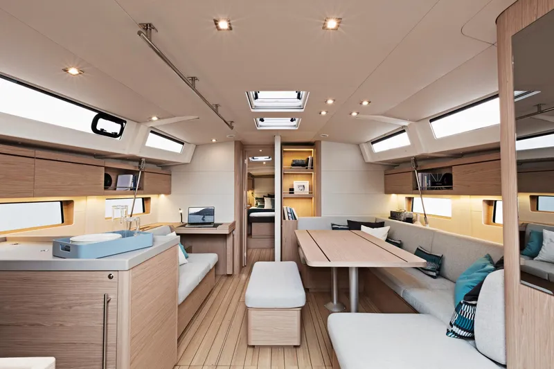 Slide: The Image of Interior of 2024 Beneteau Oceanis 46.1 sailboat with modern furnishings and ample natural light. - 27