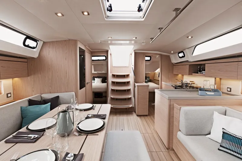 Slide: The Image of Modern interior of 2024 Beneteau Oceanis 46.1 sailboat with dining area and kitchen. - 29
