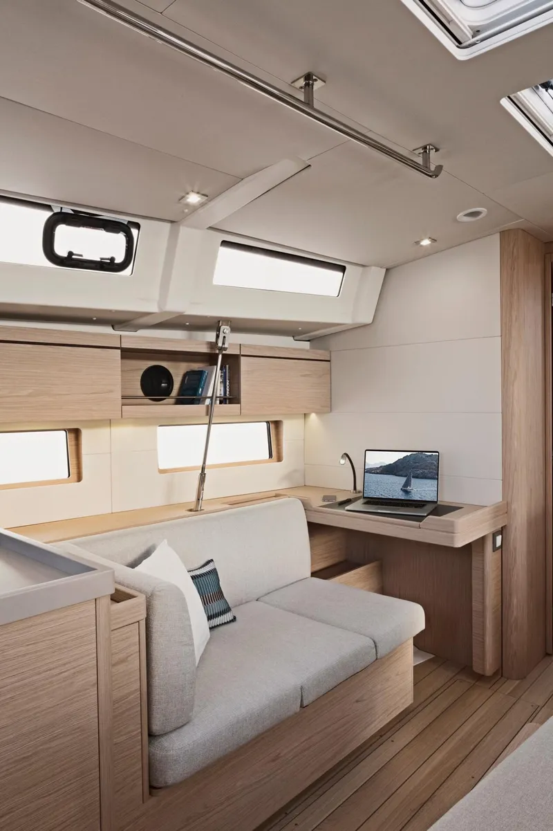 Slide: The Image of Modern interior of 2024 Beneteau Oceanis 46.1 sailboat with cozy seating and workspace. - 32