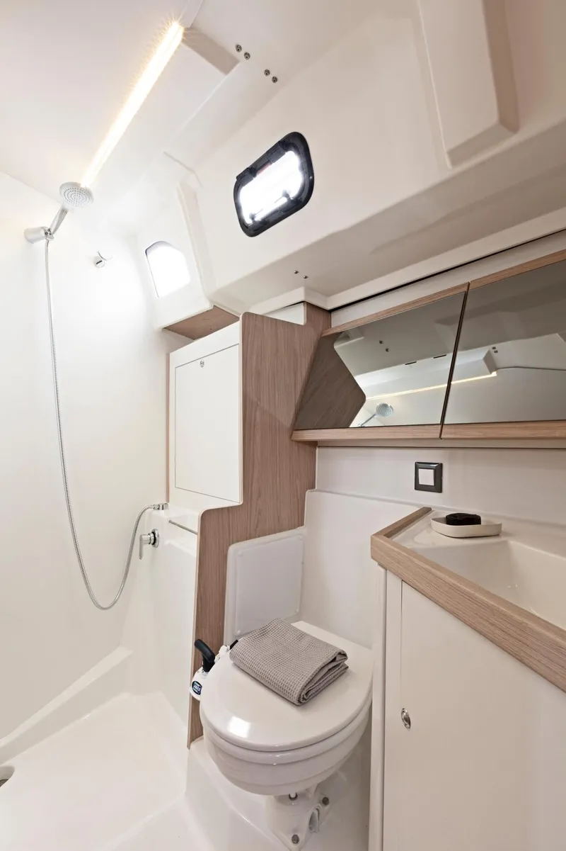 Slide: The Image of Modern bathroom in 2024 Beneteau Oceanis 46.1 yacht with shower and toilet. - 34