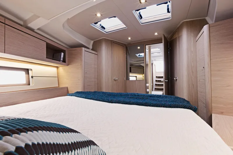 Slide: The Image of Luxurious cabin interior of 2024 Beneteau Oceanis 46.1 yacht with skylights and modern design. - 35