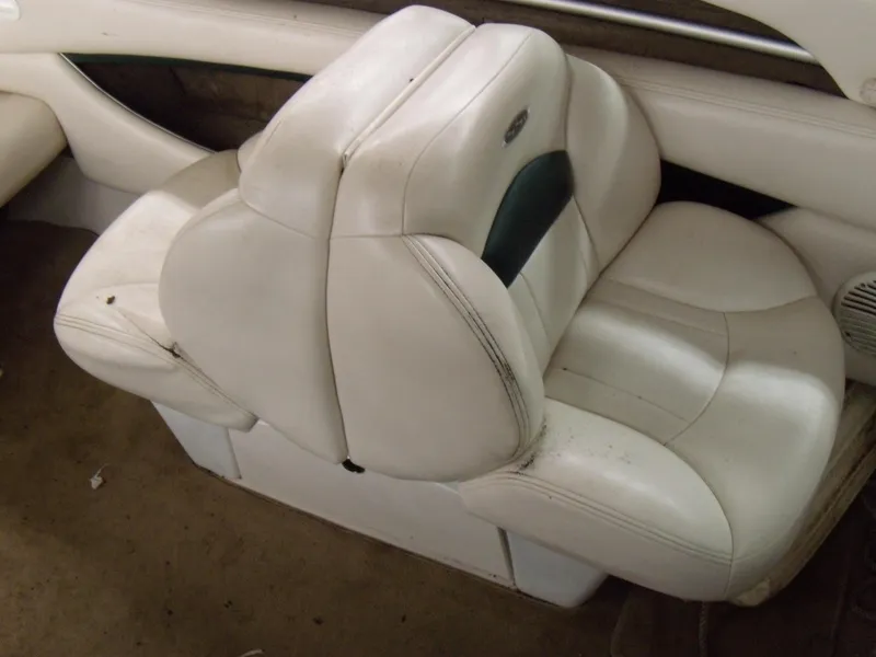 Slide: The Image of White leather seating in a 2000 Chaparral 235 SSi boat interior. - 11