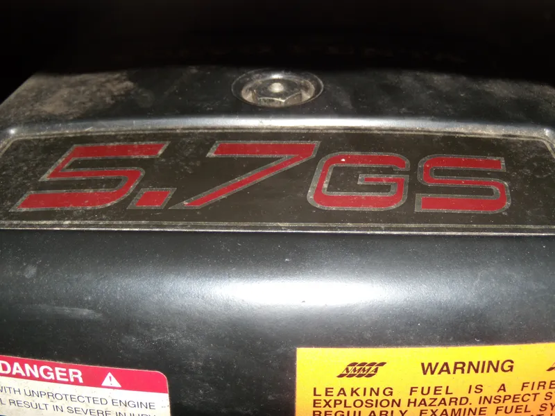 Slide: The Image of Close-up of a 5.7GS engine label on a 2000 Chaparral 235 SSi boat. - 5