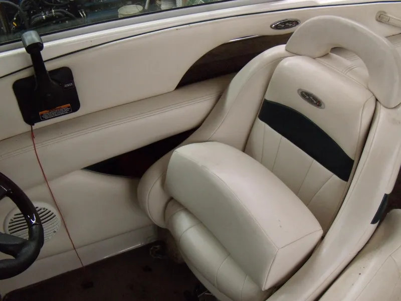 Slide: The Image of 2000 Chaparral 235 SSi boat interior with white leather seating. - 8